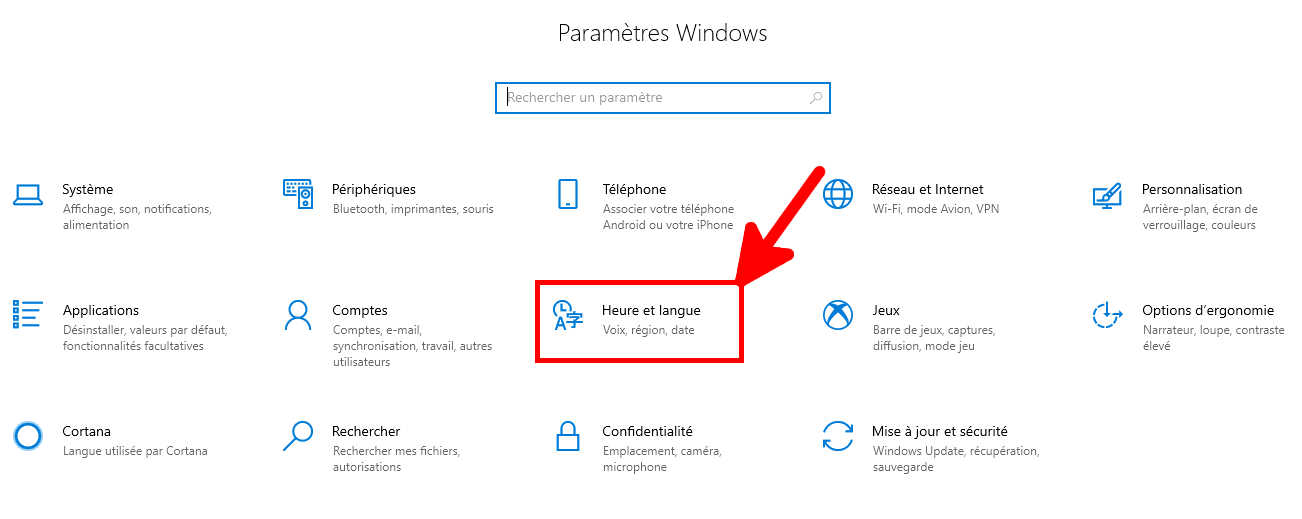 Page des paramètres Windows avec l'option « Heure et langue » en surbrillance.