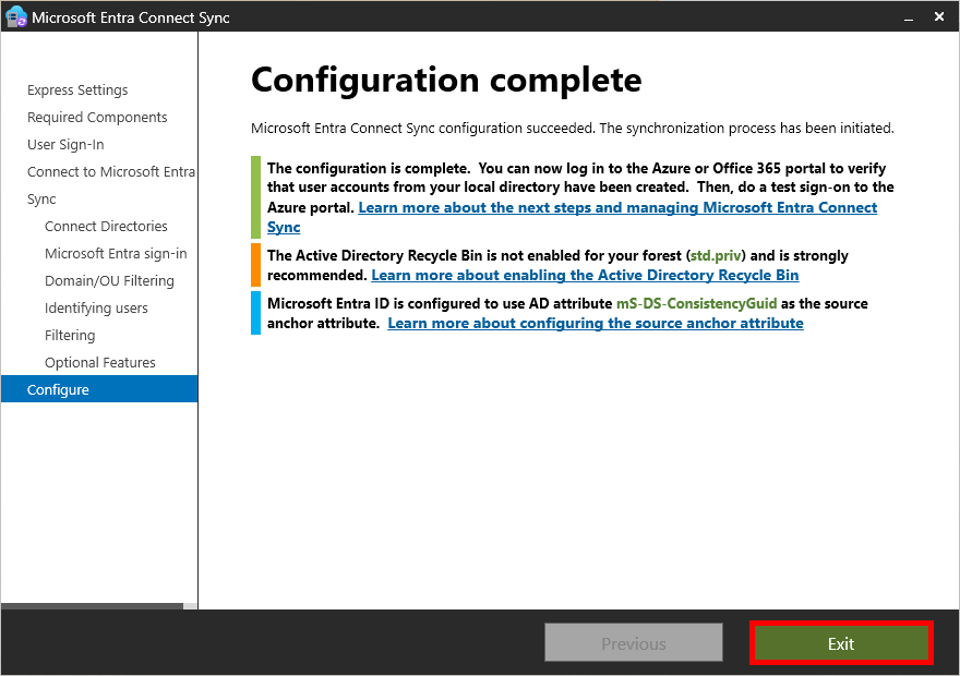 Microsoft Entra Connect Sync screen showing configuration completion. It confirms that the synchronization process has been initiated. Messages provide additional recommendations, including enabling the Active Directory Recycle Bin and configuring the source anchor attribute. The 'Exit' button is highlighted to close the setup.