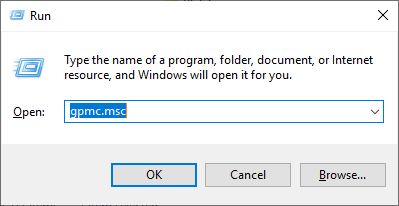 Screenshot of the Windows Run dialog box with gpmc.msc command entered, ready to open Group Policy Management.