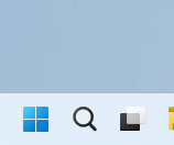 Screenshot of the Windows 11 taskbar showing the search icon next to the Start button and other pinned applications.