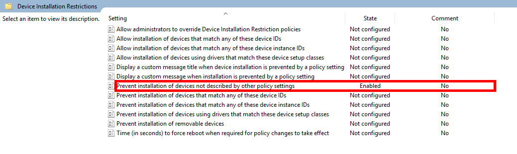 Screenshot of Group Policy editor with 'Prevent installation of devices not described by other policy settings' setting enabled under Device Installation Restrictions.