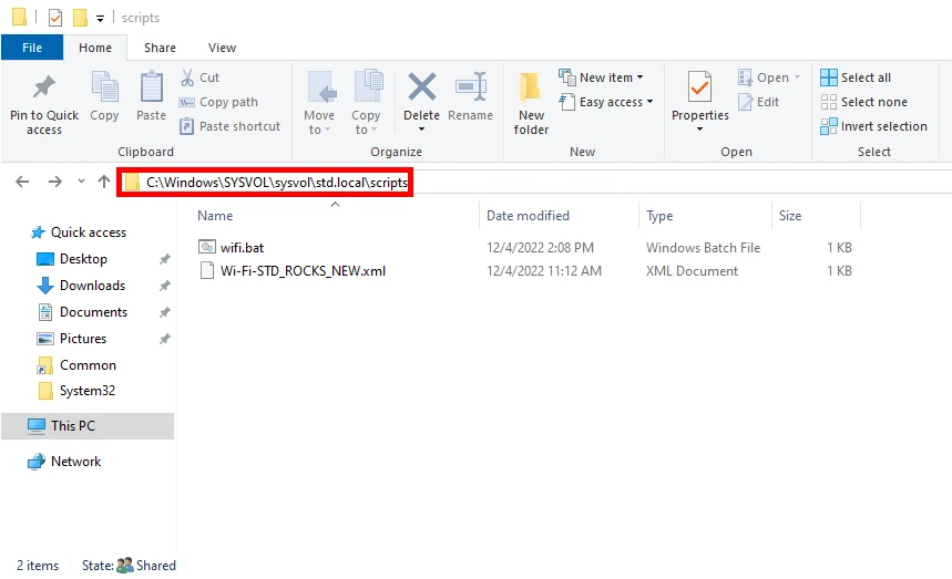 View of the Windows File Explorer showing the path to the sysvol scripts folder containing a batch file and an XML file